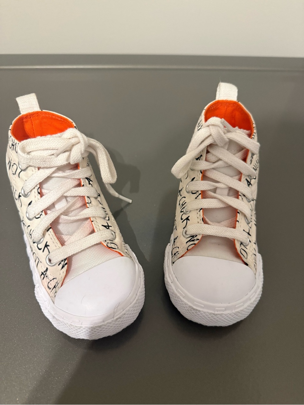 Converse Kids White Canvas Sneakers with Orange Lining and Script Detail